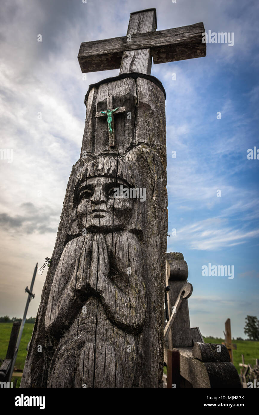 Wooden sculpture on Hill of Crosses in Lithuania Stock Photo