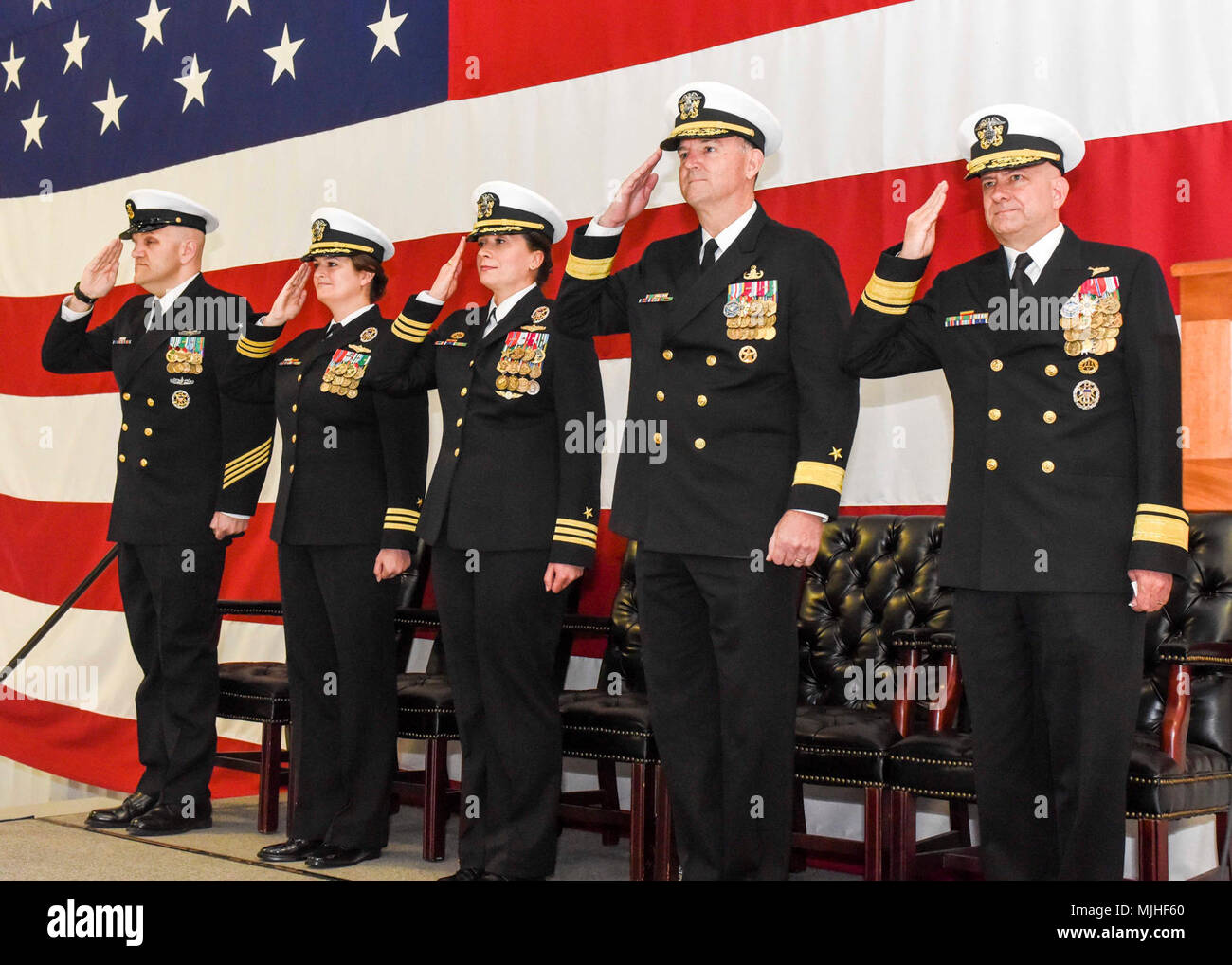 VIRGINIA Beach, Va. (April 5, 2018) – The official party salutes the colors during the Navy Expeditionary Intelligence Command (NEIC) change of command ceremony at Naval Air Station Oceana. NEIC provides Navy and Joint commanders with tactical indications and warning, force protection intelligence, sensitive site exploitation, and intelligence preparation of the operational environment required to win decisively in major combat operations. (U.S. Navy Stock Photo