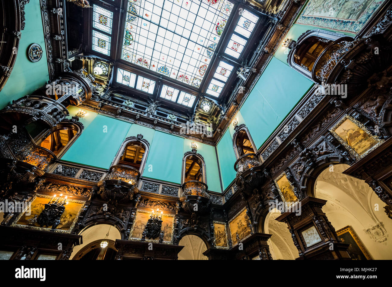 Hall of Honour (Holul de Onoare) and glass ceiling in Peles Palace, former royal castle, built between 1873 and 1914, located near Sinaia in Romania Stock Photo