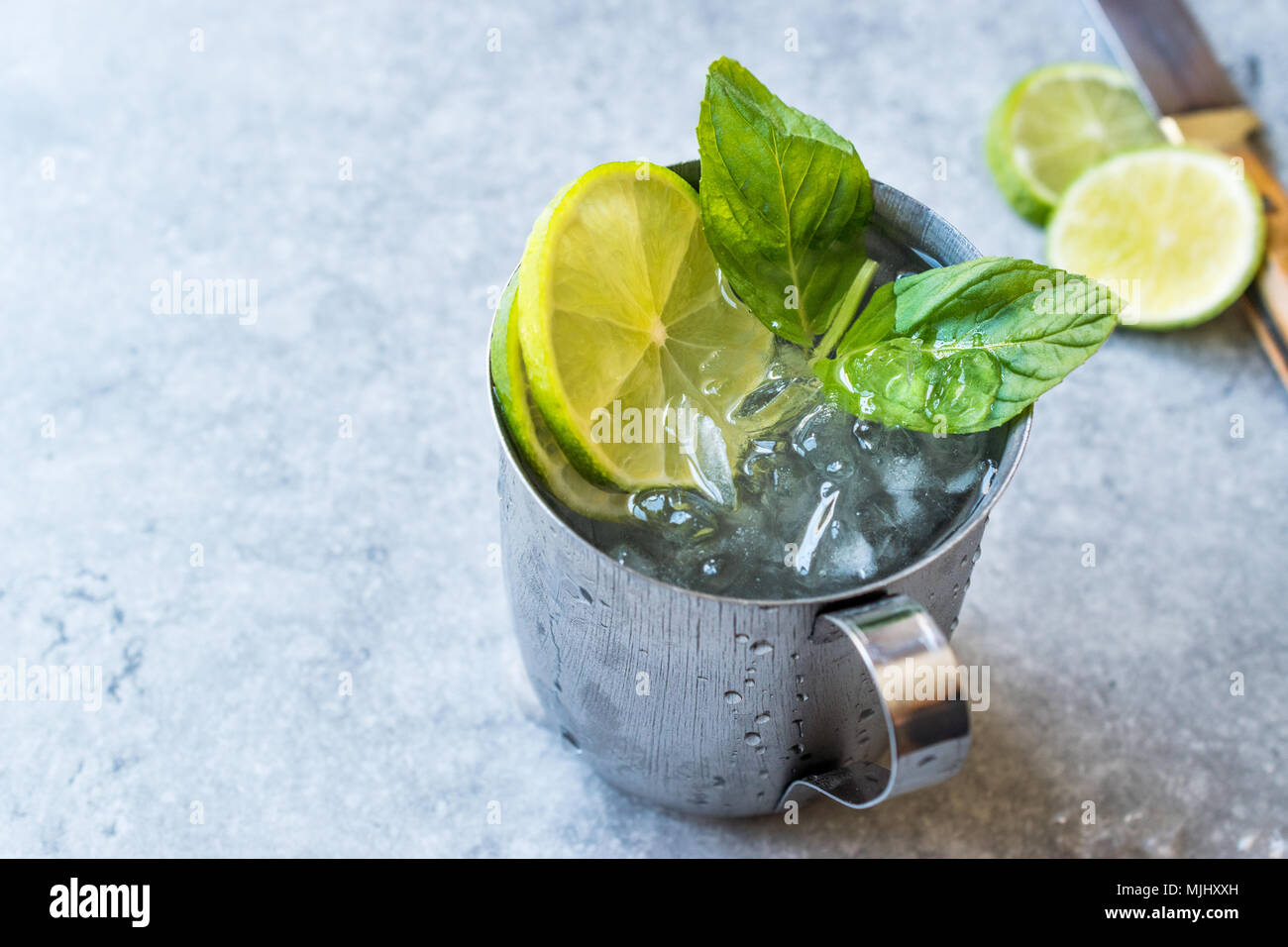 Moscow Mule Cocktail with Lime, Mint Leaves and Crushed Ice in Metal