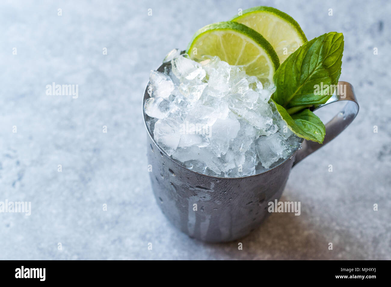Moscow Mule Cocktail with Lime, Mint Leaves and Crushed Ice in Metal