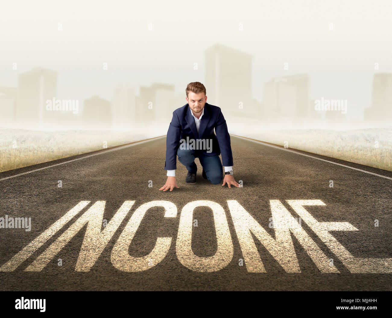 Young determined businessman kneeling before income sign Stock Photo ...