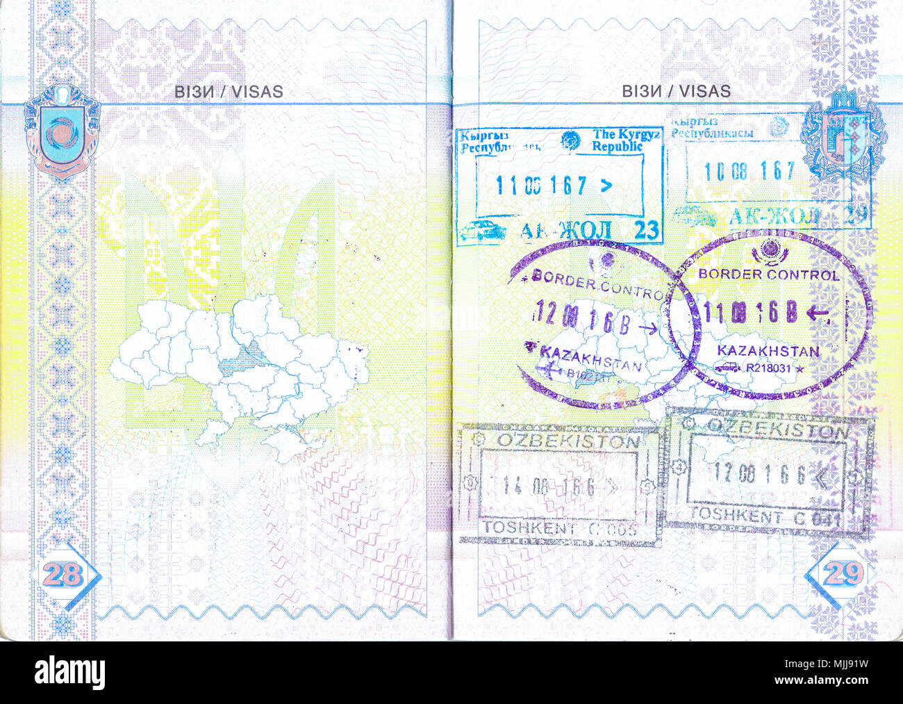 Ukrainian passport with stamps of Kyrgyzstan, Kazakhstan and Uzbekistan. Personal info removed Stock Photo