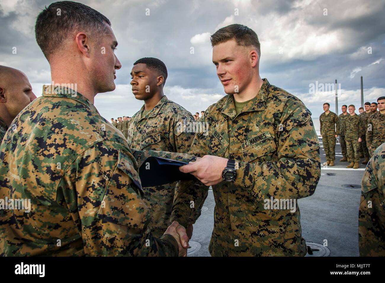 U.S. Marine Corps Cpl. Zachery R. Reece, right, a fire support Marine ...