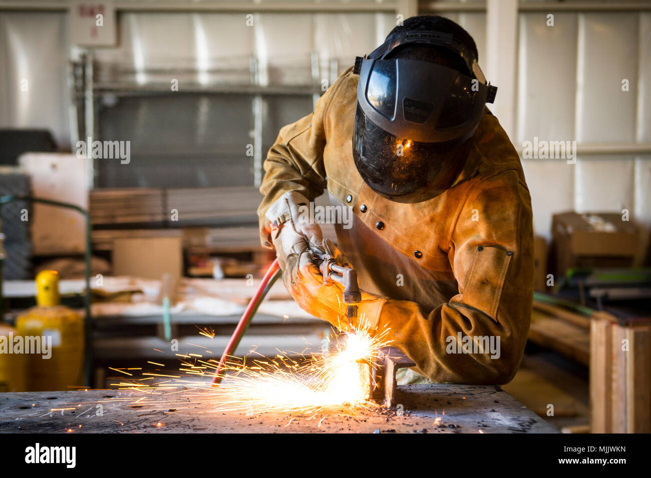 U.S. Navy Builder 2nd Class Christopher Moore, assigned to Naval Mobile ...