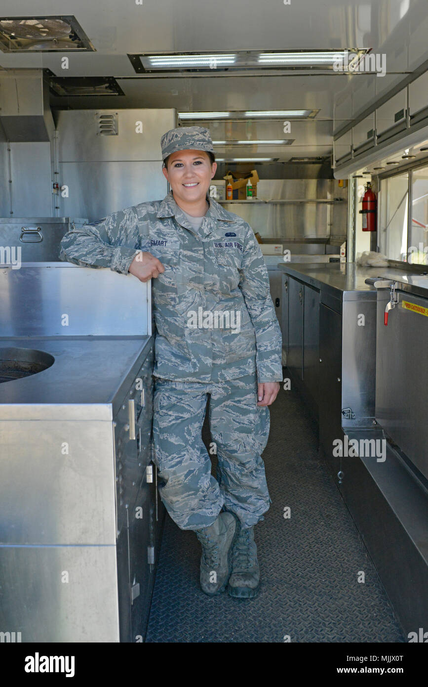 Staff Sgt. Jessica Smart, 148th Fighter Wing Services Non-commissioned Officer, poses for a picture inside of the Disaster Relief Mobile Kitchen Trailer stationed at Camp Santiago, Puerto Rico on Dec. 2, 2017.  SSgt Smart, a native of Duluth, Minn., and around 10 other airmen from the Minnesota National Guard’s 148th Fighter Wing and 133rd Airlift Wing have deployed along with the DRMKT to provide support to military and civilian disaster relief workers in the Salinas area. Stock Photo