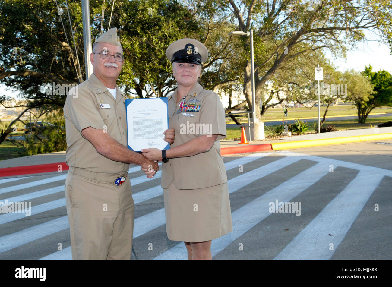 Naval Health Clinic Corpus Christi Commanding Officer, Capt. Miguel A.  Cubano presents the Meritorious Service Medal to Command Master Chief  (Surface Warfare/Fleet Marine Force) Rikki Lynn Brown Dec. 1, 2017. Brown,  from