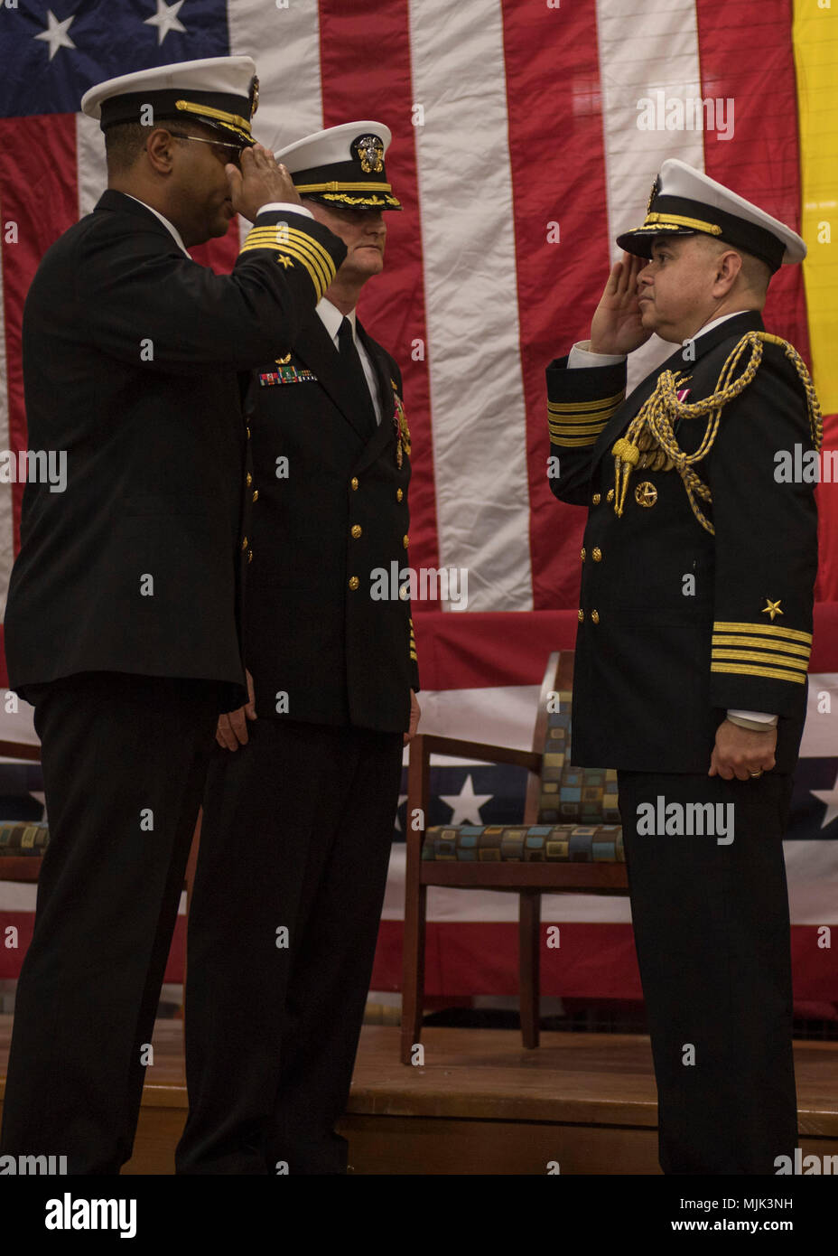 171207-N-GP524-0388  NAVAL SUPPORT FACILITY DEVESELU, Romania (December 7, 2017) Capt. Charlos Washington, left, commanding officer of Naval Support Facility (NSF) Deveselu, salutes Capt. Lawrence Vasquez, chief of staff, Navy Region Europe, Africa, Southwest Asia, after taking command during the NSF Deveselu change of command ceremony. During the ceremony Capt. Washington relieved Capt. Jon Grant as commanding officer. NSF Deveselu and Aegis Ashore Missile Defense System Romania are co-located in with the Romanian 99th Military Base and play a key role in ballistic missile defense in Eastern  Stock Photo