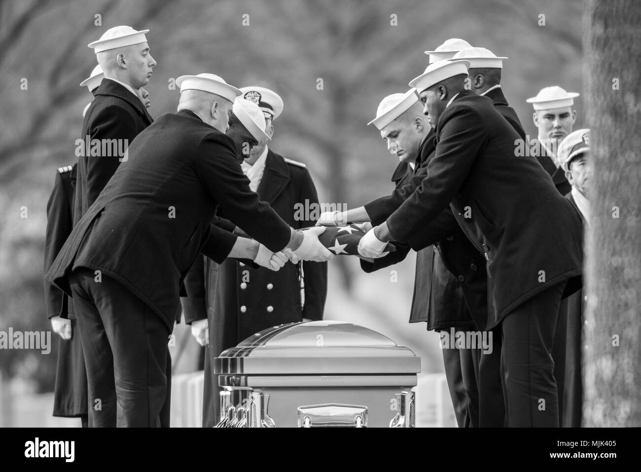 The U.S. Navy Ceremonial Guard participates in the full honors funeral of U.S. Navy Radioman 3rd Class Howard Bean in Section 60 of Arlington National Cemetery, Arlington, Virginia, Dec. 6, 2017.  Bean, along with 429 crewmen aboard the USS Oklahoma, was killed in the early morning hours of the attack on Pearl Harbor after the ship quickly capsized from numerous torpedo hits, Dec. 7, 1941.  Nearly 400 of these sailors, including Bean, were unidentified after the attack and were buried in 46 plots at the National Memorial Cemetery of the Pacific, also known as the Punchbowl, in Honolulu, Hawaii Stock Photo