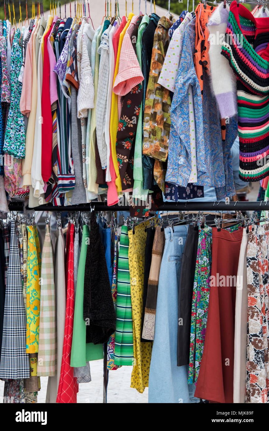 Old vintage womens clothing for sale on a rack at a retro vintage car boot  sale. Granary Square, Kings Cross, London Stock Photo - Alamy