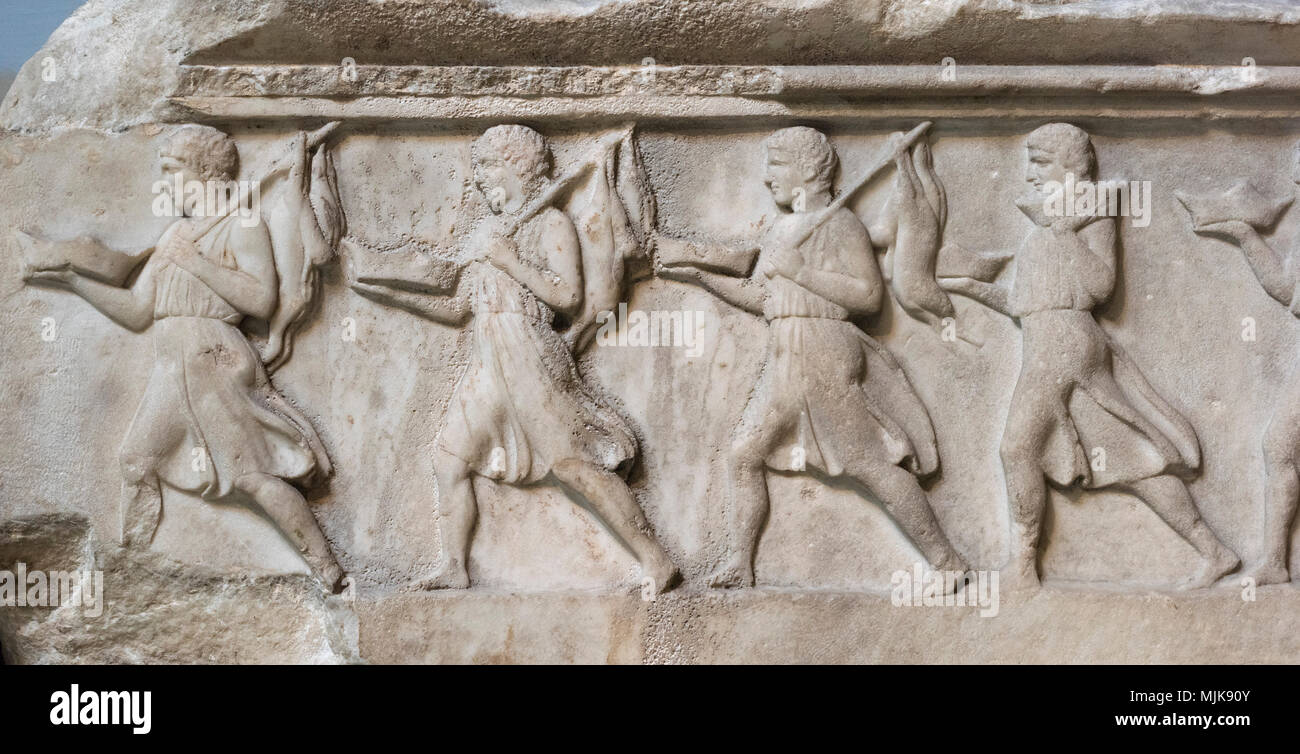 London. England. British Museum, Nereid Monument, frieze (detail), men carrying offerings, from Xanthos, Turkey, ca. 390-380 B.C.  The Nereid Monument Stock Photo