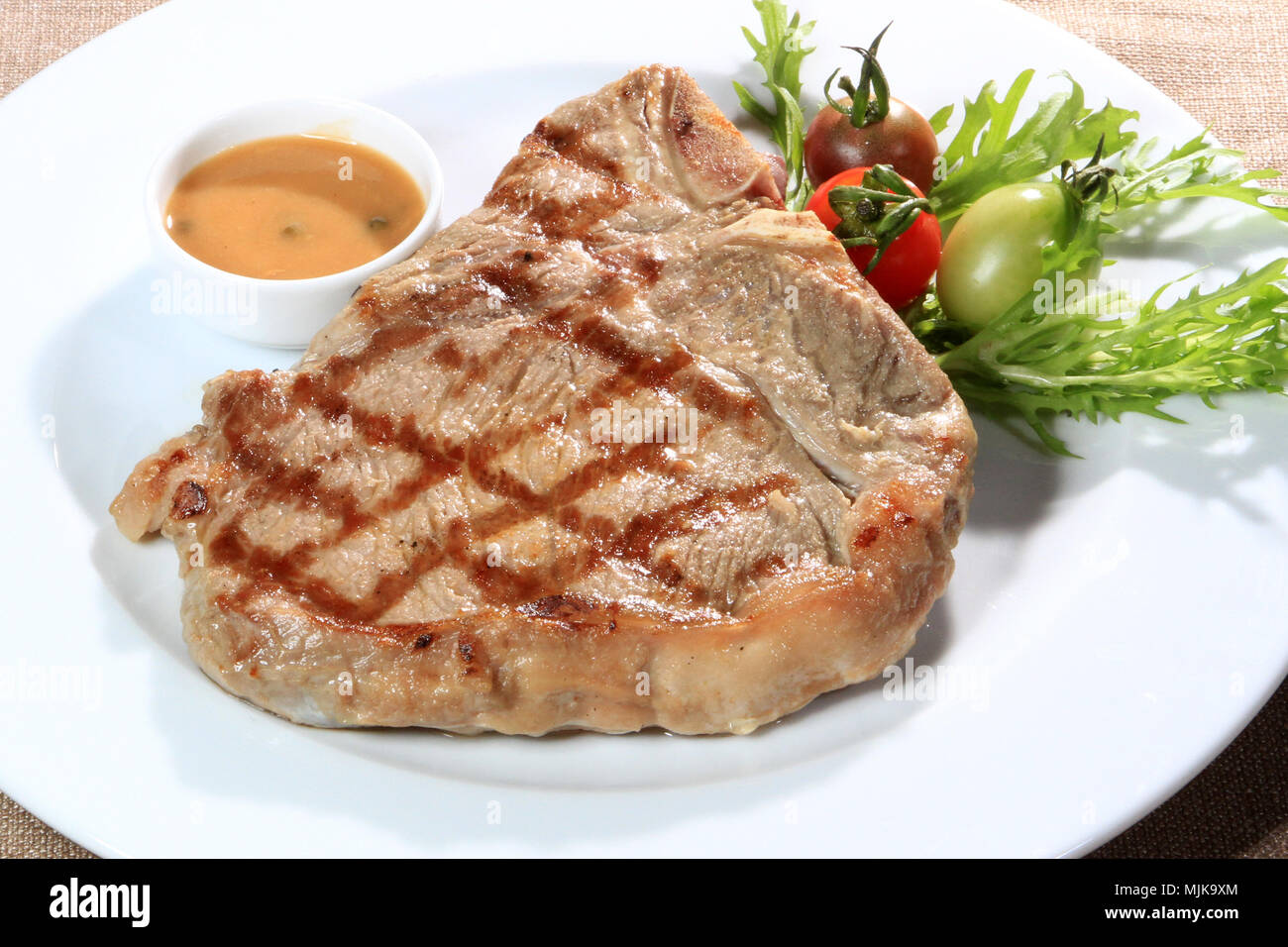 delicious grilled steak with sauce Stock Photo Alamy