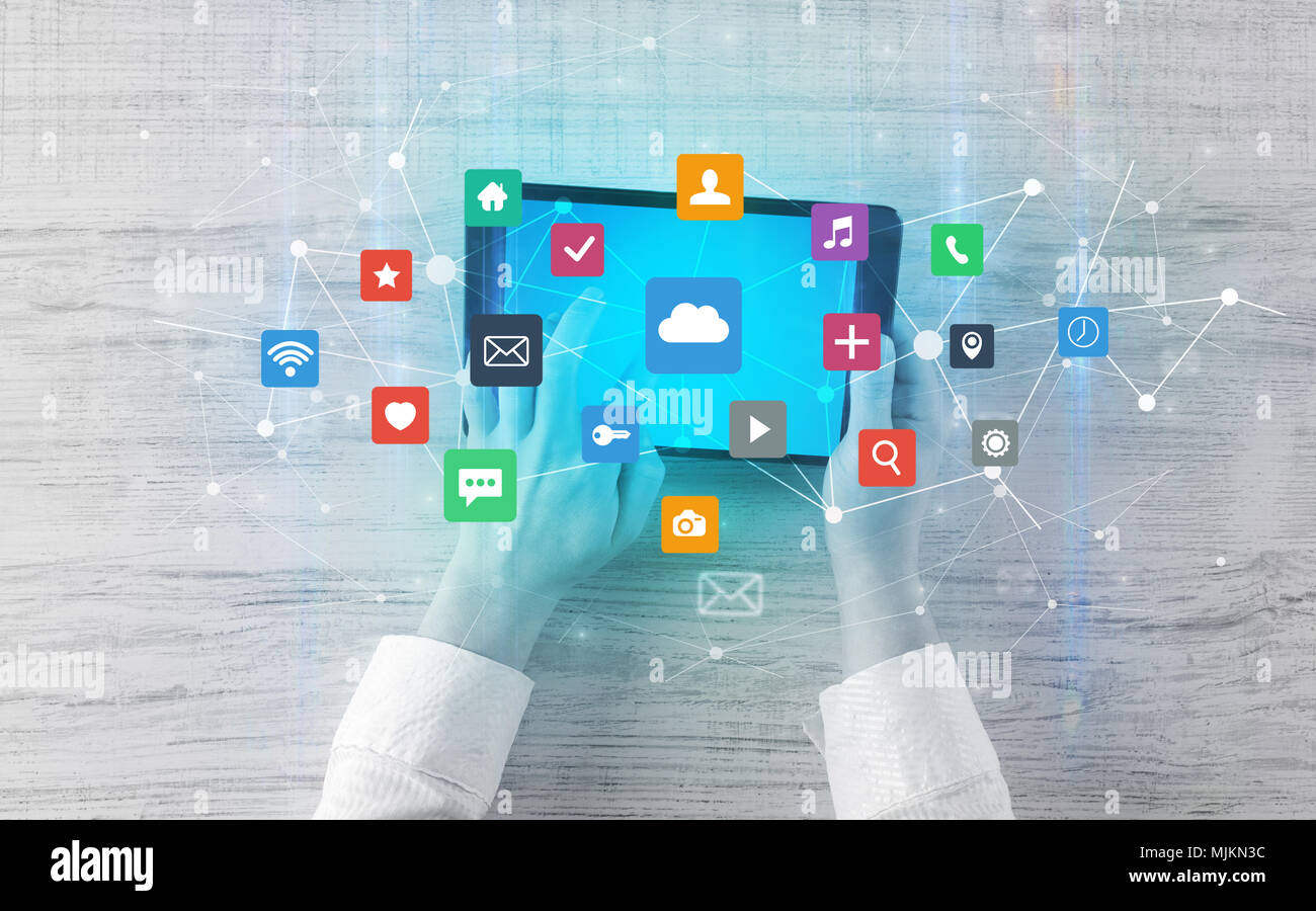 Hand touching multitask tablet with cloud wifi message social media ...
