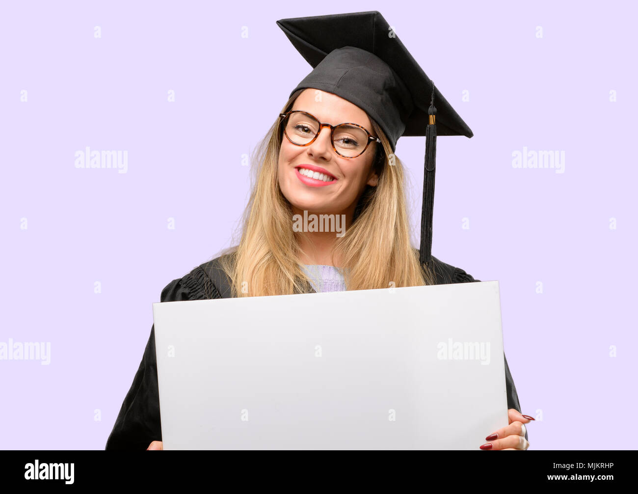 Young woman university graduate student holding blank advertising ...
