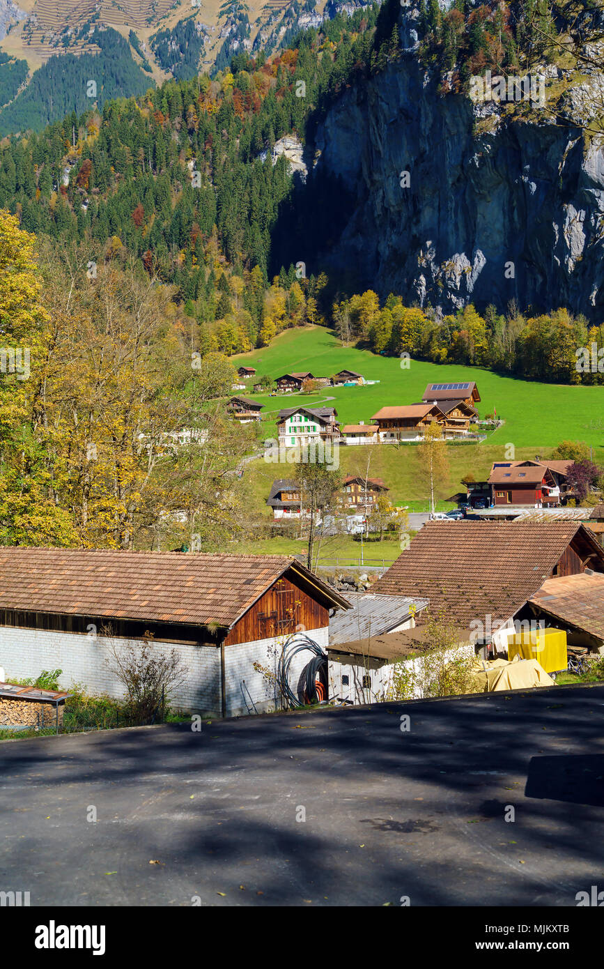 Traditional Chalets of village in Lauterbrunnen Valley at autumn ...