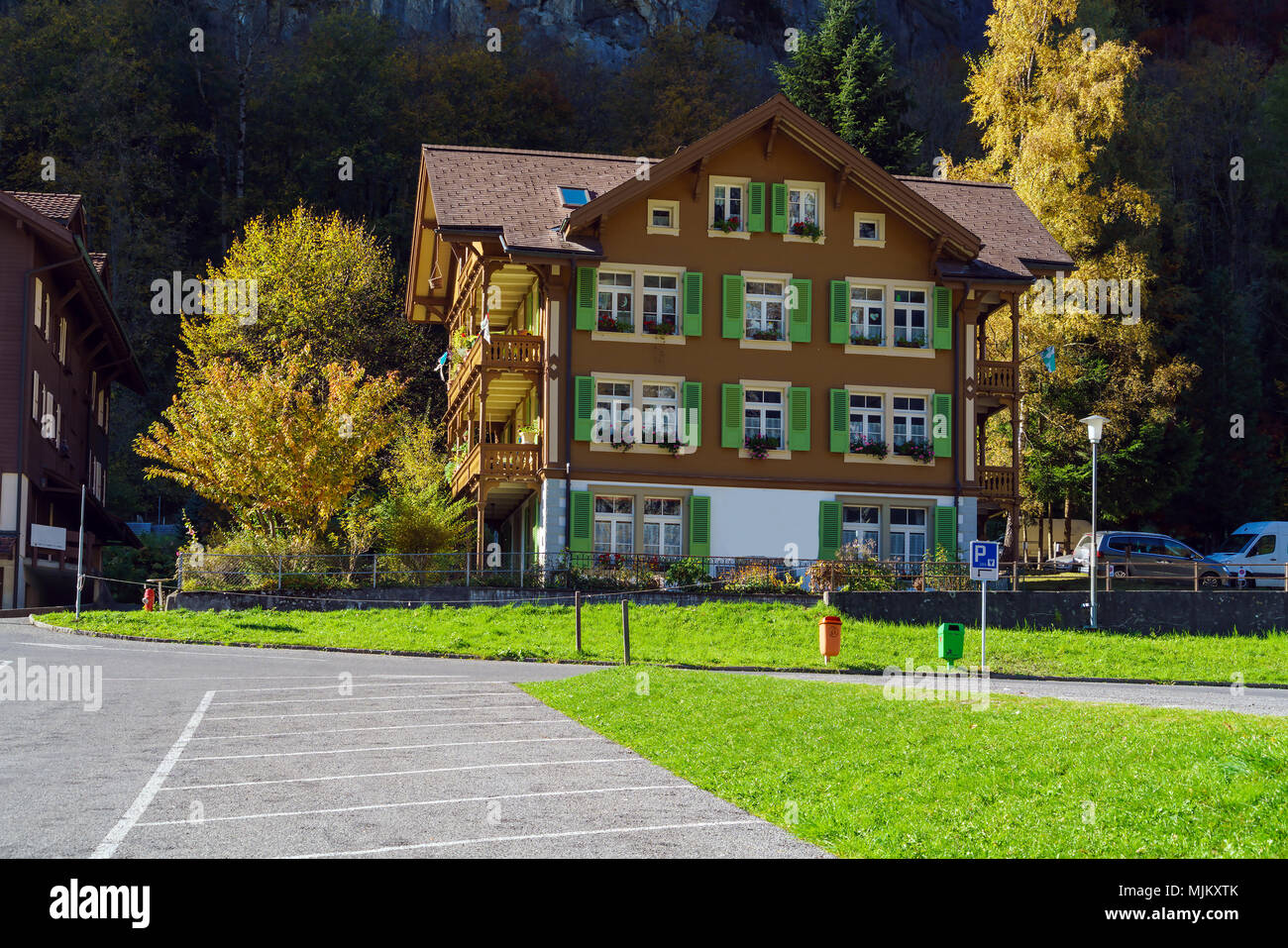 Traditional Chalets of village in Lauterbrunnen Valley at autumn ...