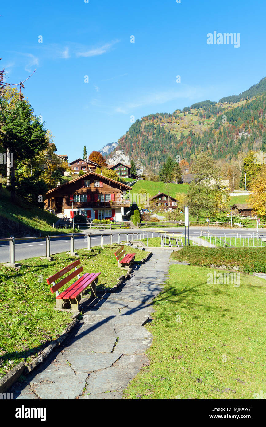 Traditional Chalets of village in Lauterbrunnen Valley at autumn ...