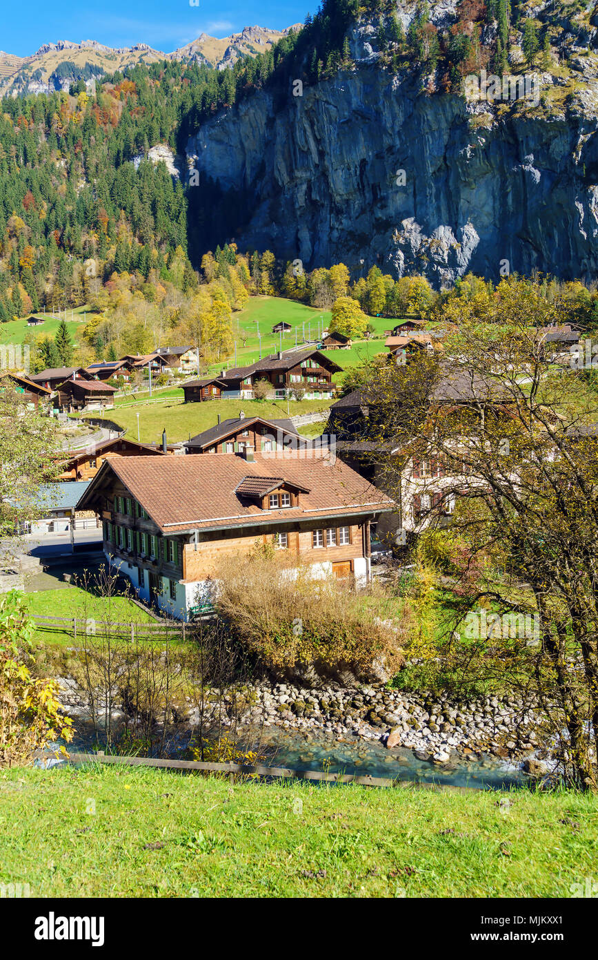 Traditional Chalets of village in Lauterbrunnen Valley at autumn ...