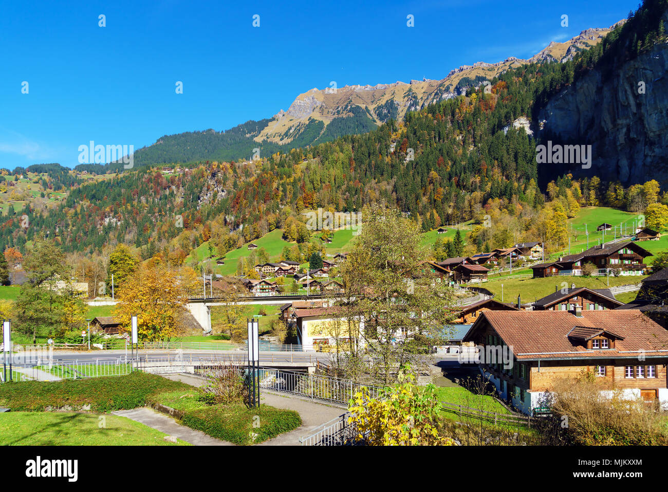 Traditional Chalets of village in Lauterbrunnen Valley at autumn ...