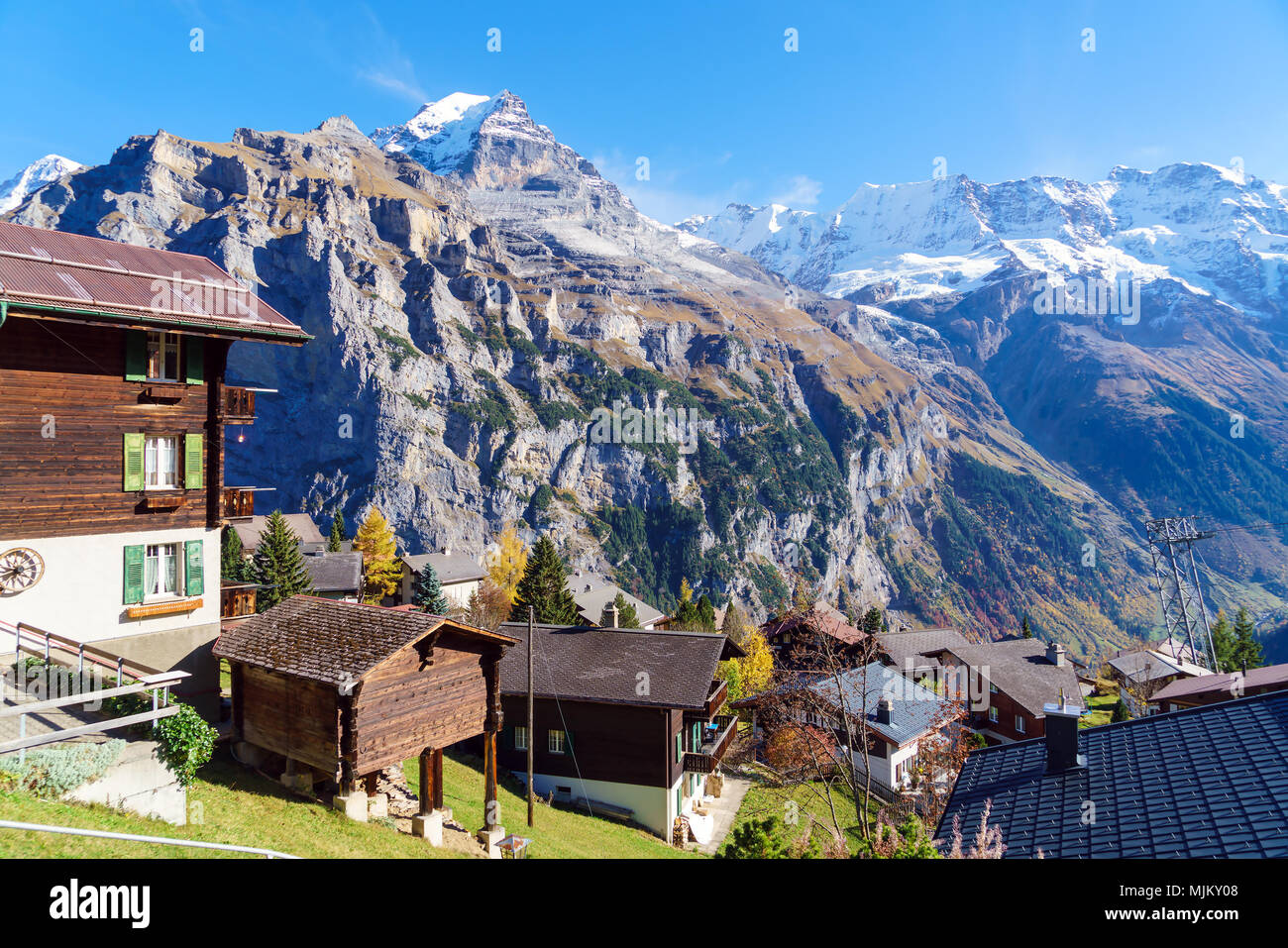 Traditional Chalets of Murren village and Jungfrau montain at autumn ...