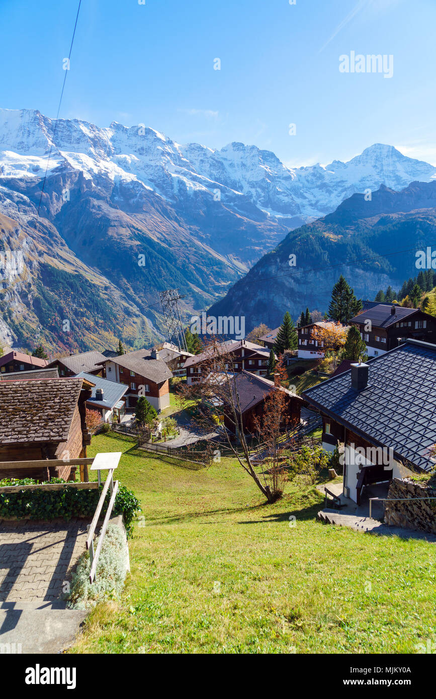 Traditional Chalets of Murren village and Jungfrau montain at autumn ...