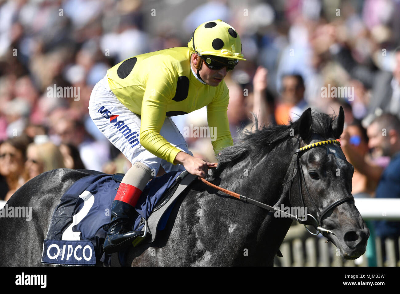 Defoe ridden by Andrea Atzeni wins the Dunaden Jockey Club Stakes during day one of the QIPCO Guineas Festival at Newmarket Racecourse. Stock Photo