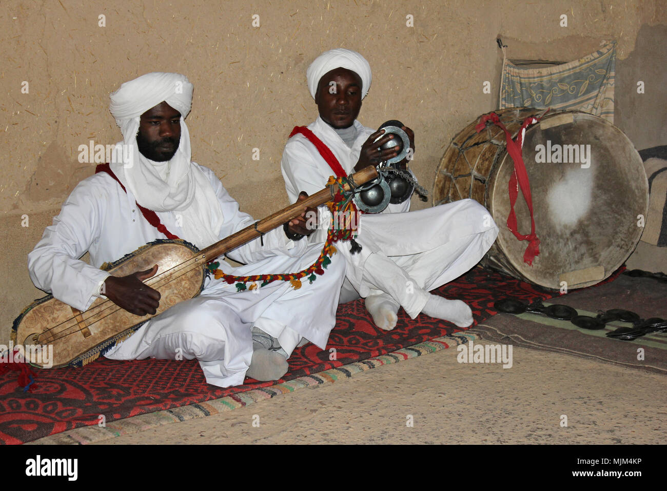 Berber Musicians Playing a Gimbrie (l) and Krakebs (r) Stock Photo