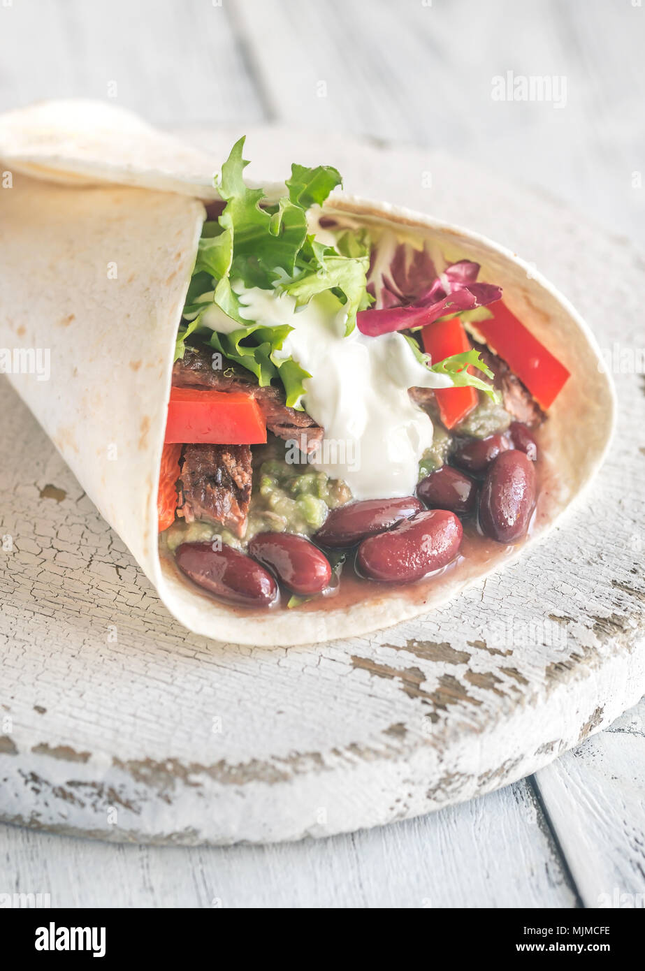 Burrito with meat and guacamole Stock Photo Alamy