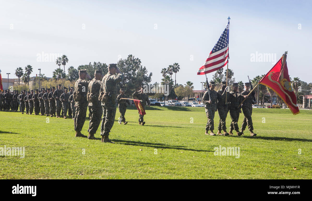 U.S. Marines with the 1st Marine Logistics Group conduct the pass and review to conclude the Combat Logistics Battalion 11 post and relief at Camp Pendleton, Calif., Dec. 8, 2017. The new sergeant major Sgt. Major Fausto Cabrera relieved Sgt. Maj. Justin Stokes who will now serve as the sergeant major of 5th Marines, 1st Marine Division. (U.S. Marine Corps photo by Cpl. Salmineo Sherman Jr.) Stock Photo