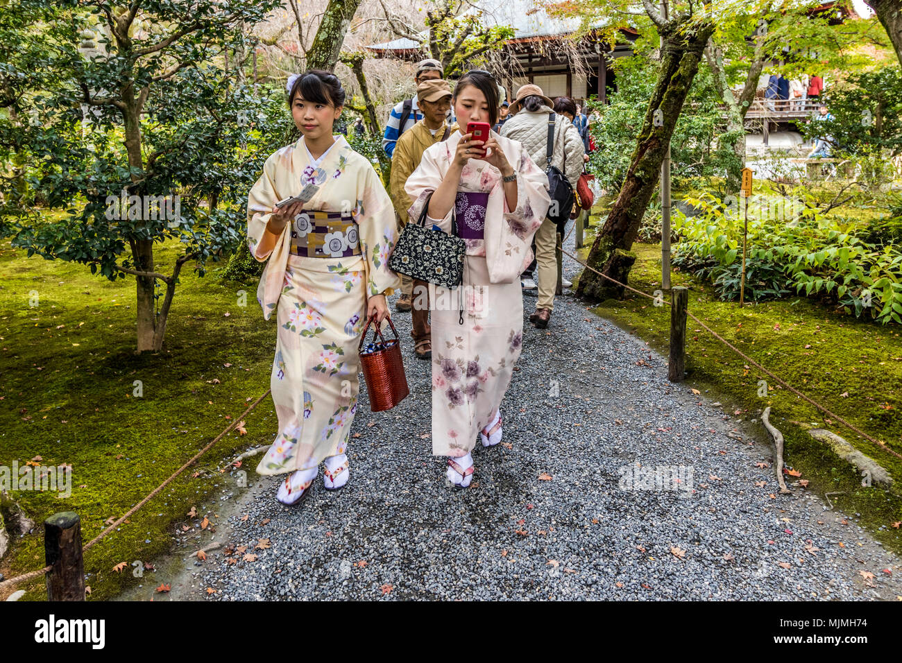 Ladies in traditional Kimono walking round streets and temple at Tenryu Shiseizen in Kyoto prefecture Japan Stock Photo