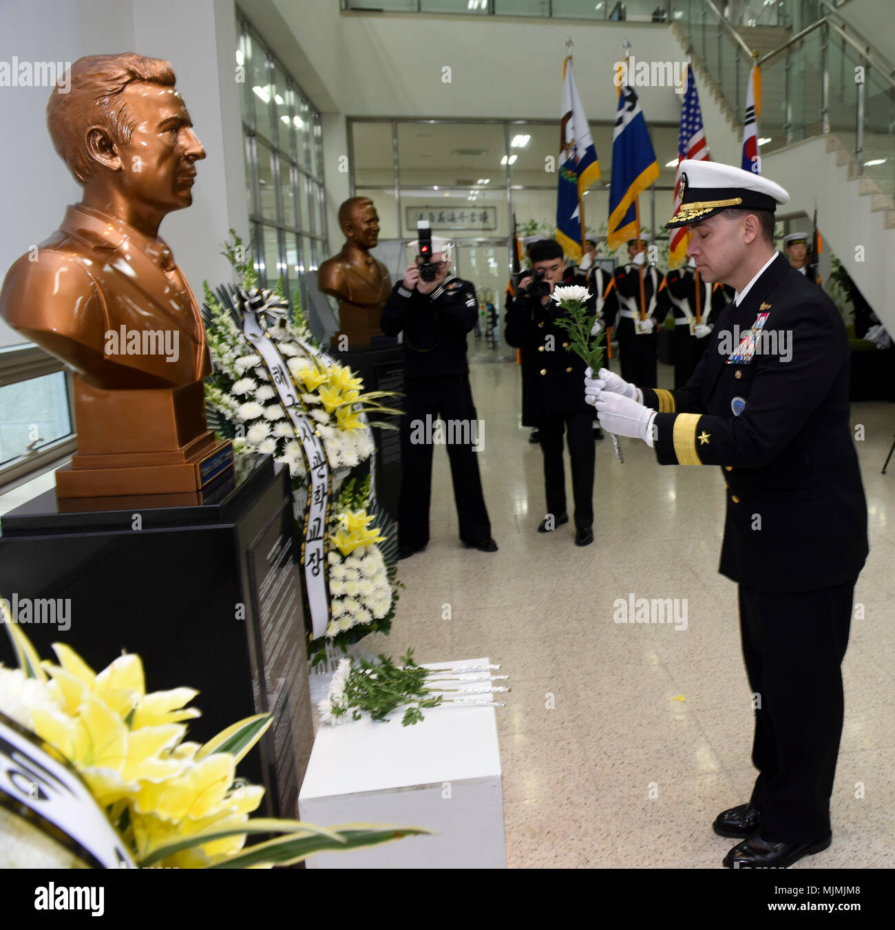 171207-N-TB148-074 CHINHAE, Republic of Korea (Dec. 07, 2017) Rear Adm. Brad Cooper, commander, U.S. Naval Forces Korea (CNFK), attends the unveiling of the Capt. Michael Lousey memorial bust unveiling ceremony at Republic of Korea (ROK) Naval Academy in Chinhae. CNFK is the U.S. Navy’s representative in the ROK, providing leadership and expertise in naval matters to improve institutional and operational effectiveness between the two navies and to strengthen collective security efforts in Korea and the region. (U.S. Navy photo by Mass Communication Specialist Seaman William Carlisle) Stock Photo