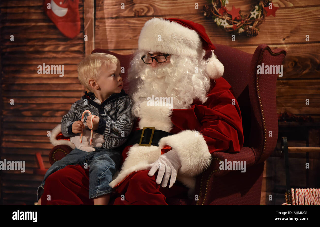 Brant Gilkison, son of Maj. Karin Gilkison, 81st Medical Operations Squadron gastroenterologist, visits with Santa during Keesler’s annual Christmas celebration at the Bay Breeze Event Center Dec. 7, 2017, on Keesler Air Force Base, Mississippi. The event, hosted by Outdoor Recreation, included cookie and ornament decorating, games and visits with Santa. (U.S. Air Force photo by Kemberly Groue) Stock Photo