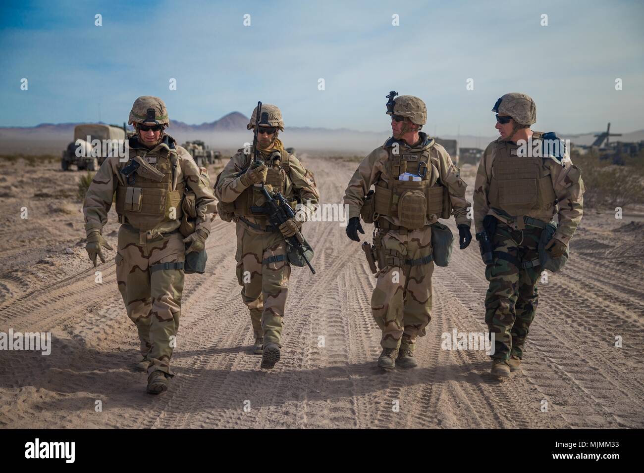 U.S. Marine Corps Maj. Gen. Eric M. Smith, center right, the commanding general for 1st Marine Division, walks alongside his staff during a battle field circulation (BFC) at Marine Corps Air Ground Combat Center, Twentynine Palms, Calif., Dec. 10, 2017. Smith's BFC consisted of visiting various units participating in exercise Steel Knight 2018. (U.S. Marines Corps photo by Staff Sgt. Gabriela Garcia) Stock Photo