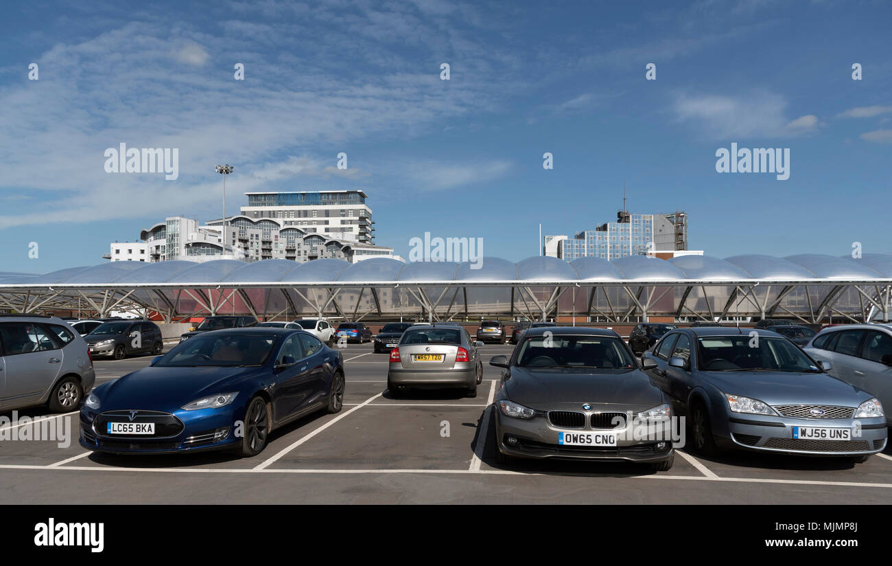 Basingstoke,Hampshire,England, UK. Apartments and office buildings seen above a multistorey car