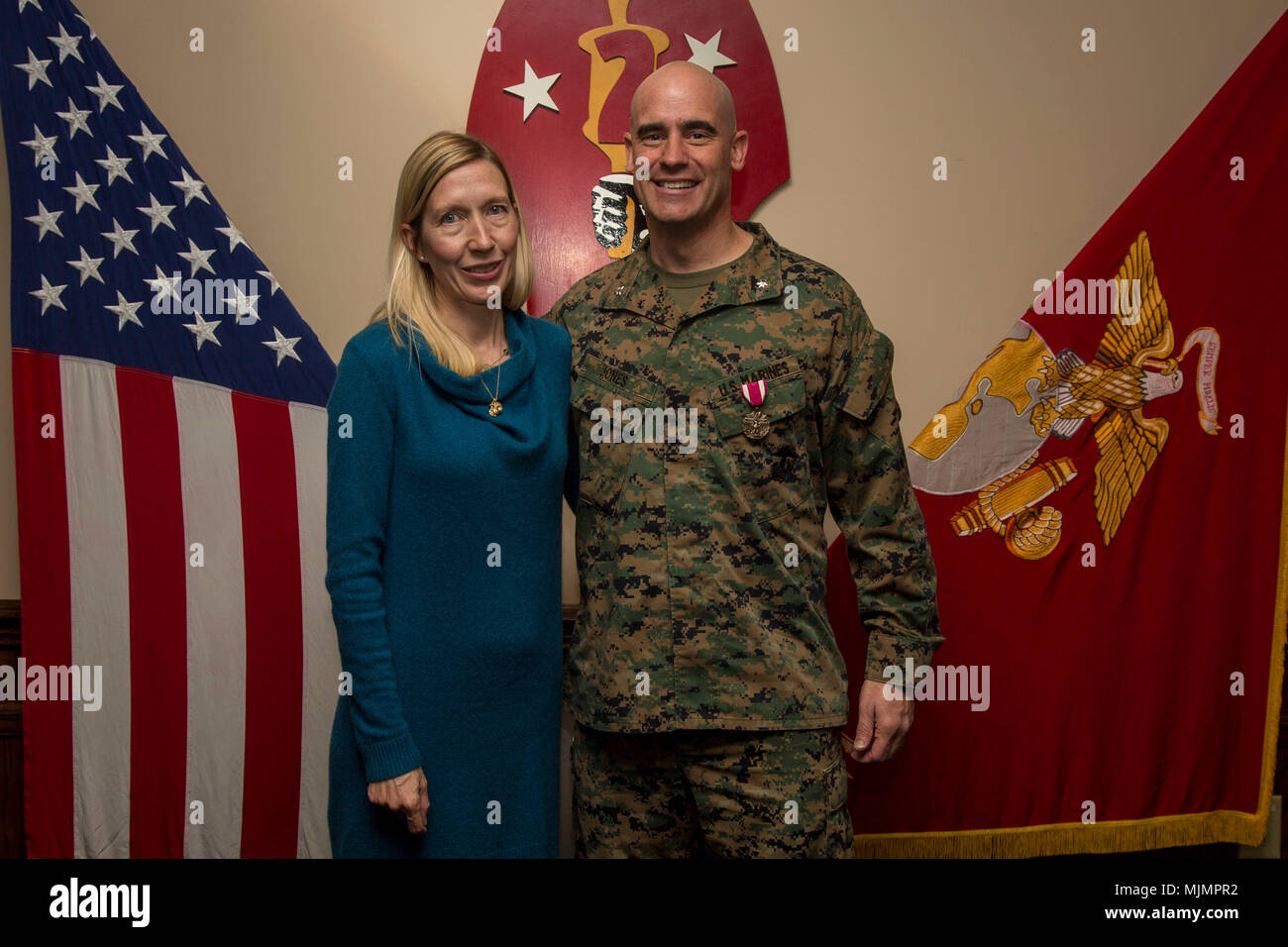 U.S. Marine Corps Lt. Col. Kemper A. Jones poses with his wife following his award ceremony on Camp Lejeune, N.C., Dec. 7, 2017. Jones was awarded the Meritorious Service Medal by Maj. Gen. John K. Love, commanding general, 2nd Marine Division (2d MARDIV). (U.S. Marine Corps photo by Lance Cpl. Taylor N. Cooper) Stock Photo