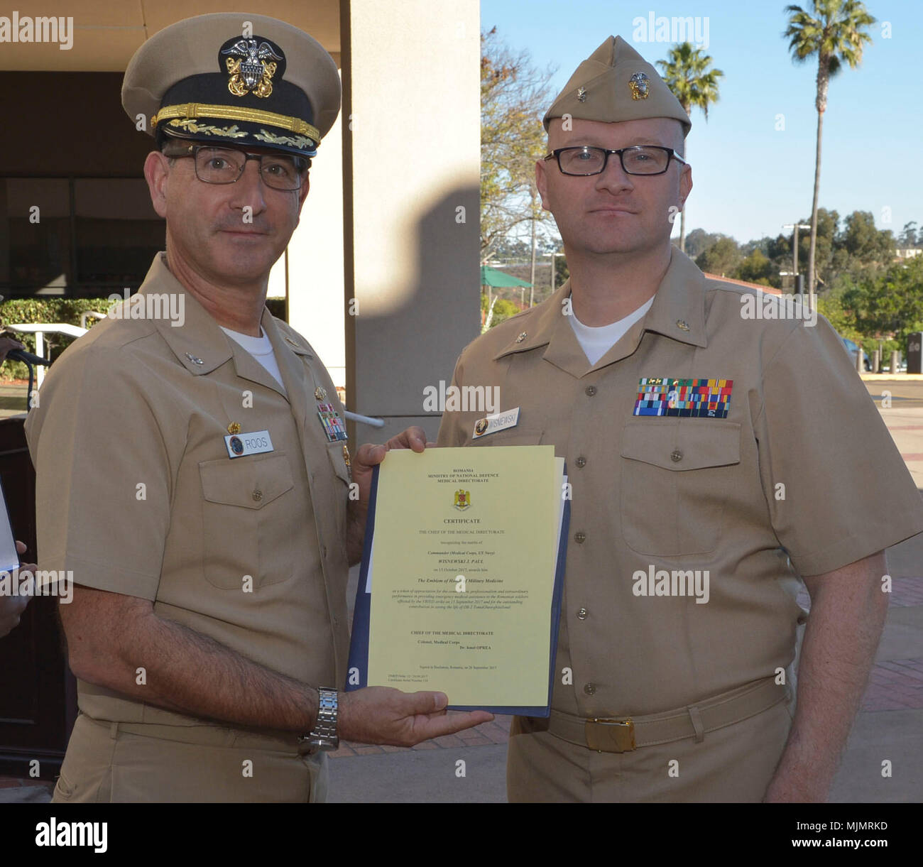 171212-N-NH199-057 (SAN DIEGO) -- Cmdr. Paul Wisnewski was presented a  Romanian Emblem of Honor of Military Medicine for his acts while overseas.  The award was presented as a token of appreciation for