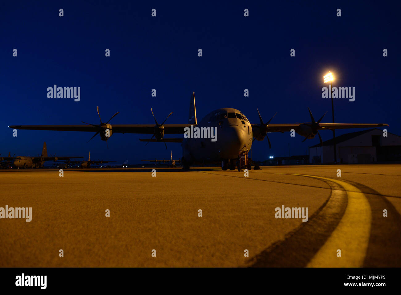 A U.S. Air Force C-130J Super Hercules assigned to Little Rock Air Force Base, Ark., prepares to taxi during the Joint Forcible Entry 17B on the flight line at Dyess Air Force Base, Texas, Dec. 9, 2017. During the U.S. Air Force Weapons School JFE 17B, the students flying and decision-making skills are tested in the execution of various missions over the Nevada Test and Training Range. (U.S. Air Force photo by Airman River Bruce) Stock Photo