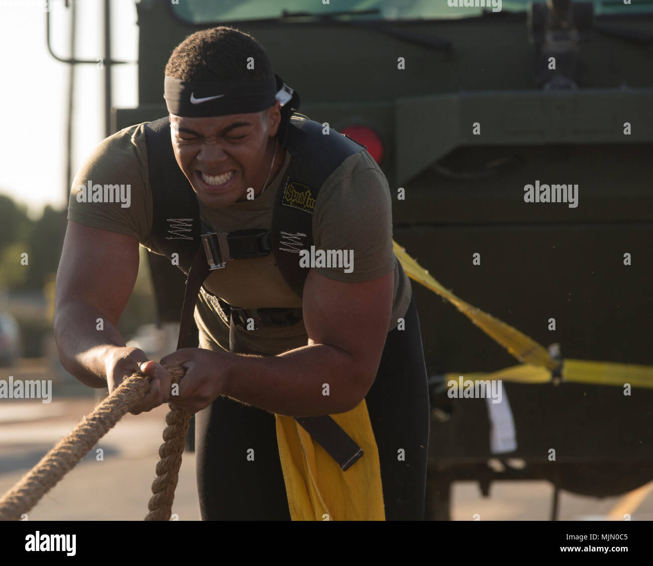 U.S. Marine Corps Sgt. Christopher Deon Fisher Jr., an Aviation Ordnance Technician assigned to Marine Aviation Logistics Squadron 13, stationed at Marine Corps Air Station (MCAS) Yuma, Ariz., pulls a P-19R Aircraft Rescue and Firefighting vehicle to practice for the Strongman Competition Dec. 15, 2017 on the station parade deck. The practice is to prepare for the Bull of the Desert Strongman Competition slated Feb. 17, 2018 in Yuma, Ariz. (U.S. Marine Corps photo by Lance Cpl. Sabrina Candiaflores) Stock Photo