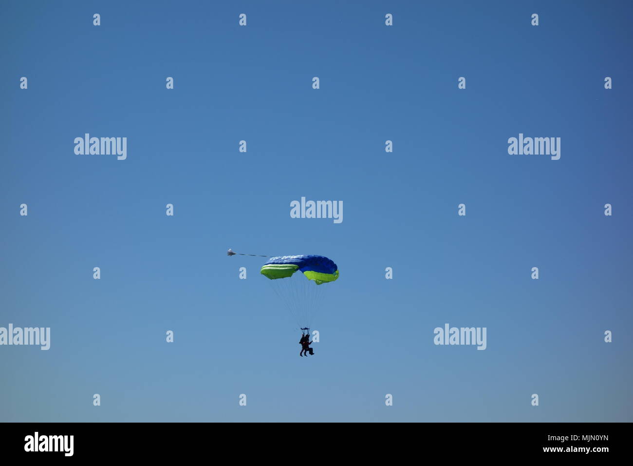 Tandem parachuting, a descent to landing Stock Photo