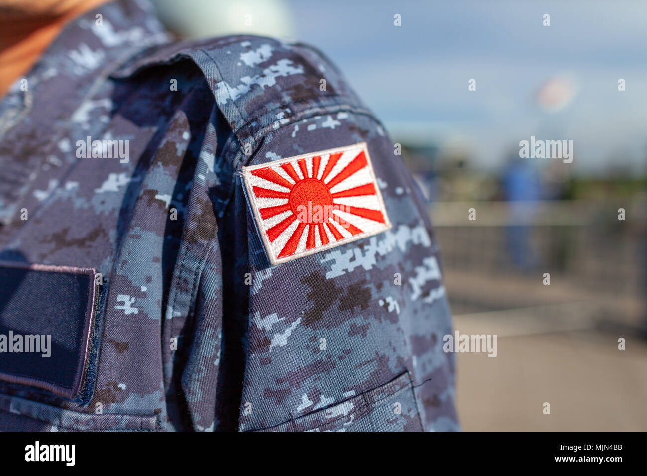 Rising Sun Flag of Japan patch on a soldier uniform Stock Photo