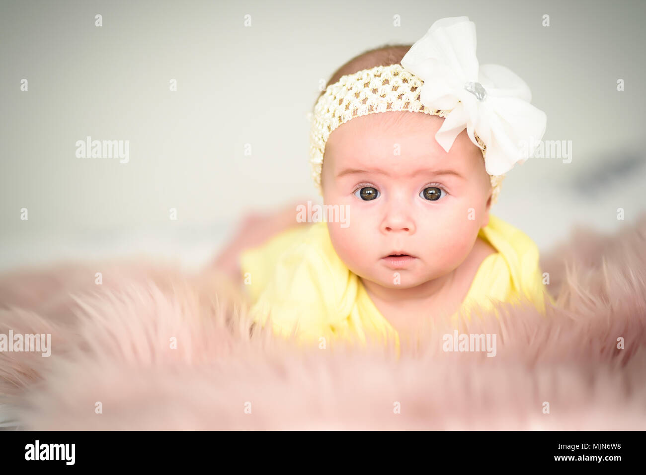Curious 4 Months Old Baby Girl On A Bed Looking Into Camera With Her Big Brown Eyes And Open Mouth Stock Photo Alamy Curious 4 Months Old Baby Girl On A Bed Looking Into Camera With Her Big Brown Eyes And Open Mouth Stock Photo Alamy