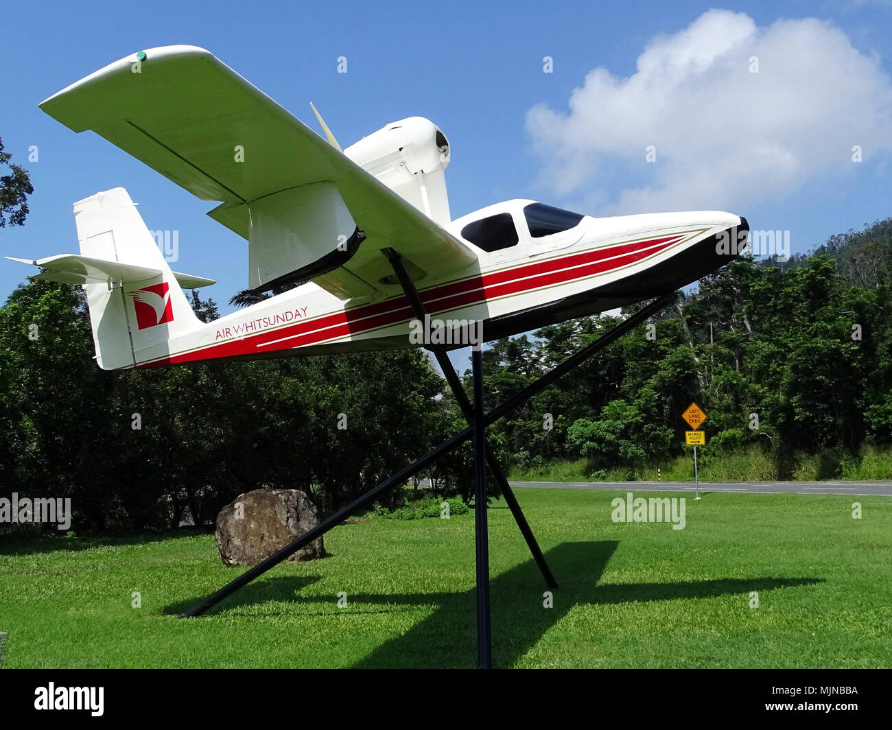 An old small Air Whitsunday float plane with a high mounted propellor and enginei Stock Photo