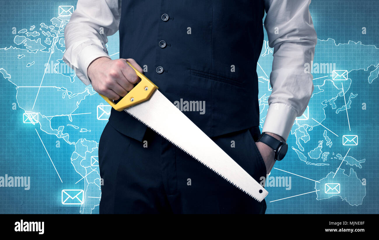 Businessman holding tool with global map graphic on the background Stock Photo