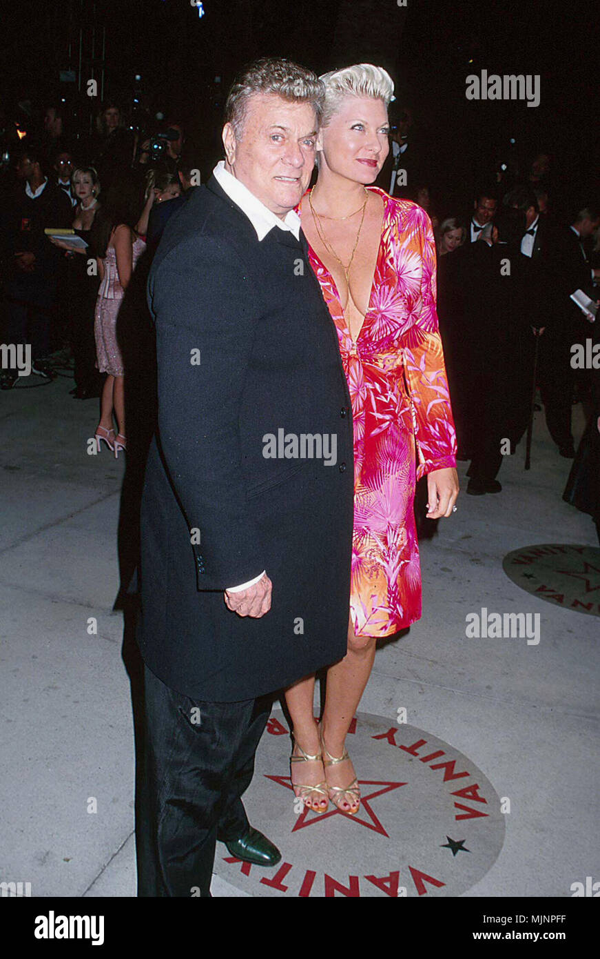 26 Mar 2000, Los Angeles, California, USA --- Tony Curtis with Wife Jill Vandenberg --- ' Tsuni / Bourquard 'Tony Curtis with Wife Jill Vandenberg Tony Curtis with Wife Jill Vandenberg Tony Curtis with Wife Jill Vandenberg Event in Hollywood Life - California,  Red Carpet Event, Vertical, USA, Film Industry, Celebrities,  Photography, Bestof, Arts Culture and Entertainment, Topix  Celebrities fashion /  from the Red Carpet-1994-2000, one person, Vertical, Best of, Hollywood Life, Event in Hollywood Life - California,  Red Carpet and backstage, USA, Film Industry, Celebrities,  Photography, Bes Stock Photo