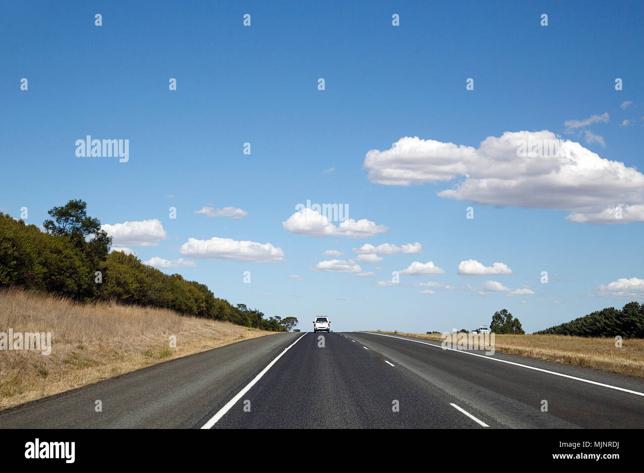 Following a white pick up truck on the highway in rural Victoria State ...