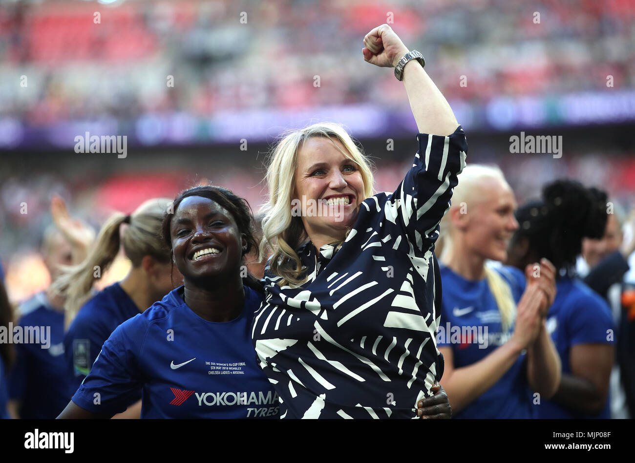 Chelsea Ladies manager Emma Hayes (right) and Eniola Aluko (left) celebrate after the final whistle during the SSE Women's FA Cup Final at Wembley Stadium, London. PRESS ASSOCIATION Photo. Picture date: Saturday May 5, 2018. See PA story SOCCER Women Final. Photo credit should read: Adam Davy/PA Wire. RESTRICTIONS: No use with unauthorised audio, video, data, fixture lists, club/league logos or 'live' services. Online in-match use limited to 75 images, no video emulation. No use in betting, games or single club/league/player publications. Stock Photo
