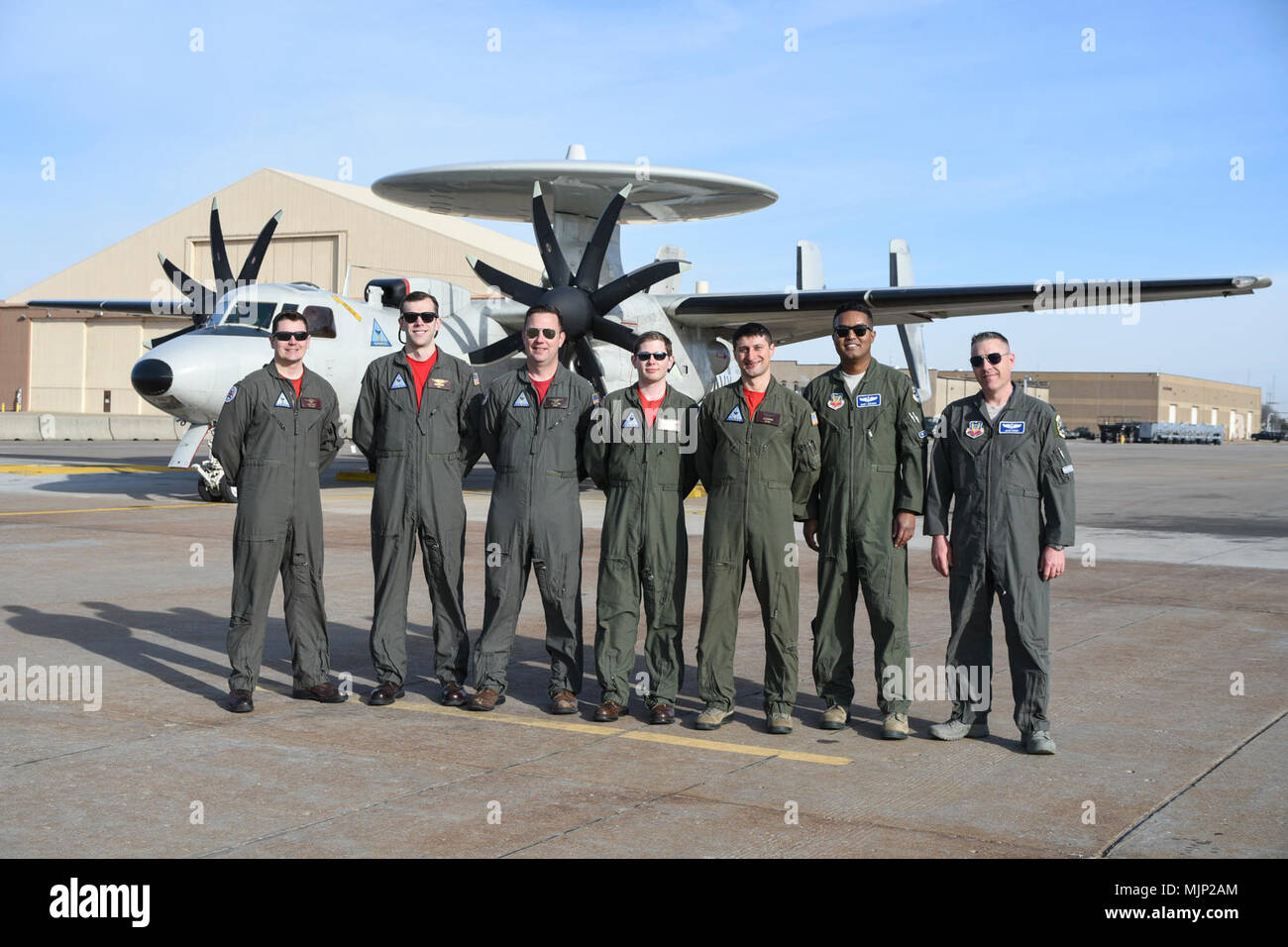 The crew of a Navy E2C Hawkeye Airborne Early Warning aircraft from