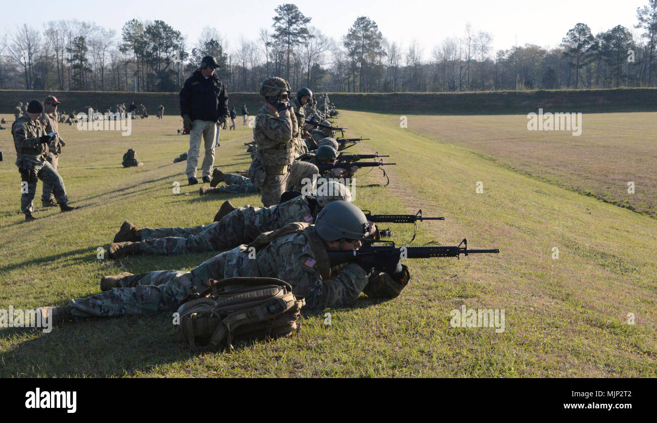 FORT BENNING, Ga.—Soldiers from around the Army fire their rifles in a combat rifle match March 13 during the 2018 U.S. Army Small Arms “All Army” Championship, hosted by the U.S. Army Marksmanship Unit (USAMU). More than 200 Soldiers participated in the All Amy that consisted of five days of intense competition, training and instruction conducted by USAMU instructors and shooters. Armed Forces and civilians displaying courage bravery dedication commitment and sacrifice Stock Photo