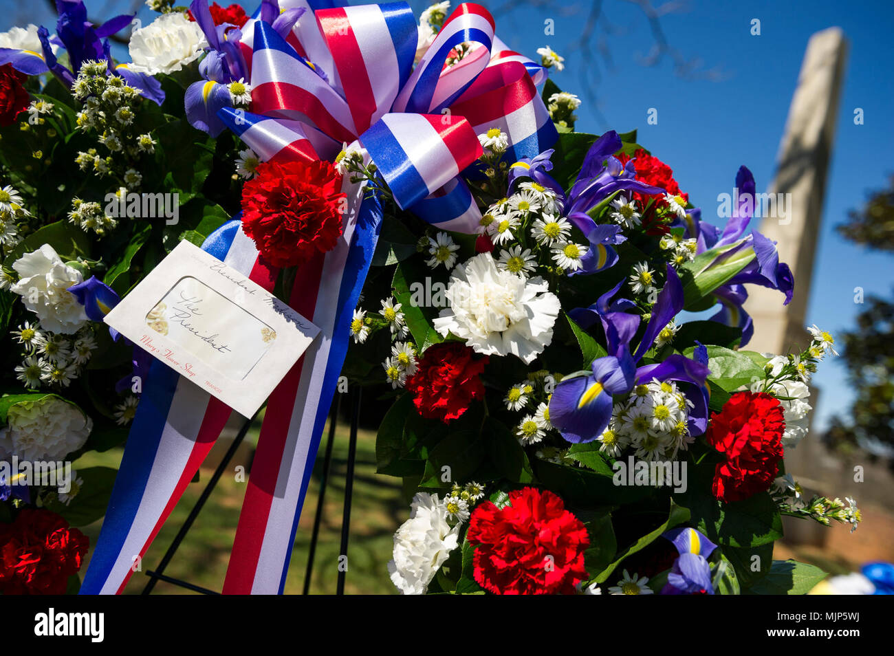 The Presidential wreath provided by President Donald J. Trump, is displayed during the wreath laying ceremony held in honor of the 4th President of the United States, James Madison, also known as the Father of the Constitution, at his home at Montpelier, Orange, Va., March 16, 2018. This event was held in commemoration of the 267th anniversary of the birth of Madison, born in 1751, and has also been decreed as James Madison Appreciation Day for the Commonwealth of Virginia. Armed Forces and civilians displaying courage bravery dedication commitment and sacrifice Stock Photo