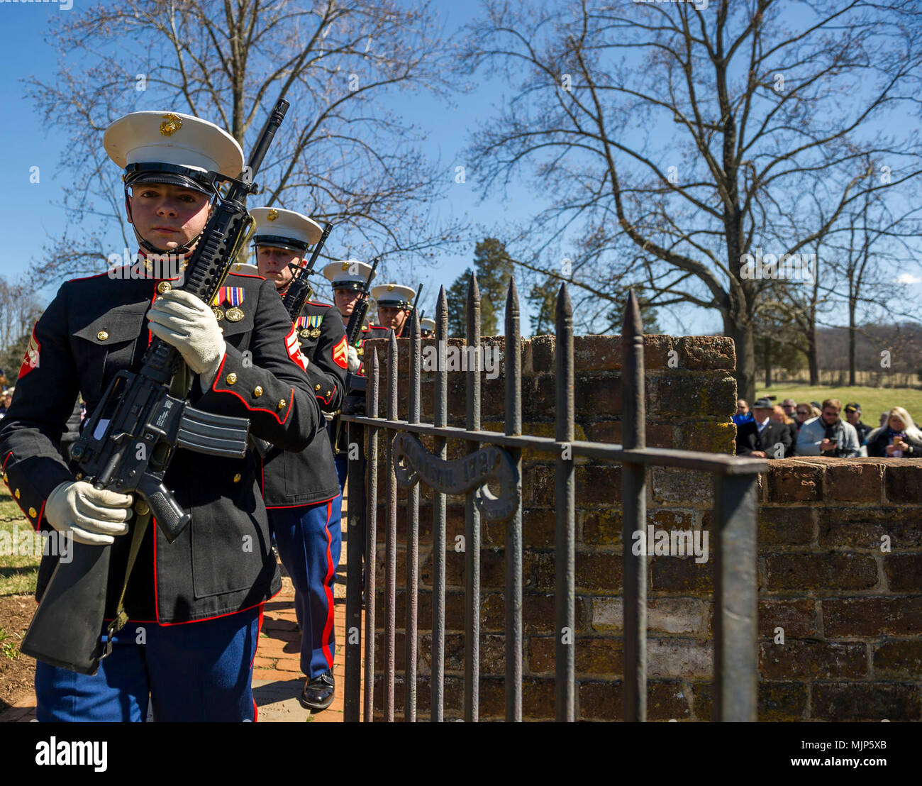 U.S. Marines with Marine Corps Base Quantico Ceremonial Platoon enter the cemetery for the Presidential wreath laying ceremony held in honor of the 4th President of the United States, James Madison, also known as the Father of the Constitution, at his home at Montpelier, Orange, Va., March 16, 2018. This event was held in commemoration of the 267th anniversary of the birth of Madison, born in 1751, and has also been decreed as James Madison Appreciation Day for the Commonwealth of Virginia. Armed Forces and civilians displaying courage bravery dedication commitment and sacrifice Stock Photo